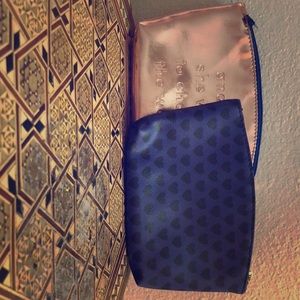 Two used Ipsy makeup bags